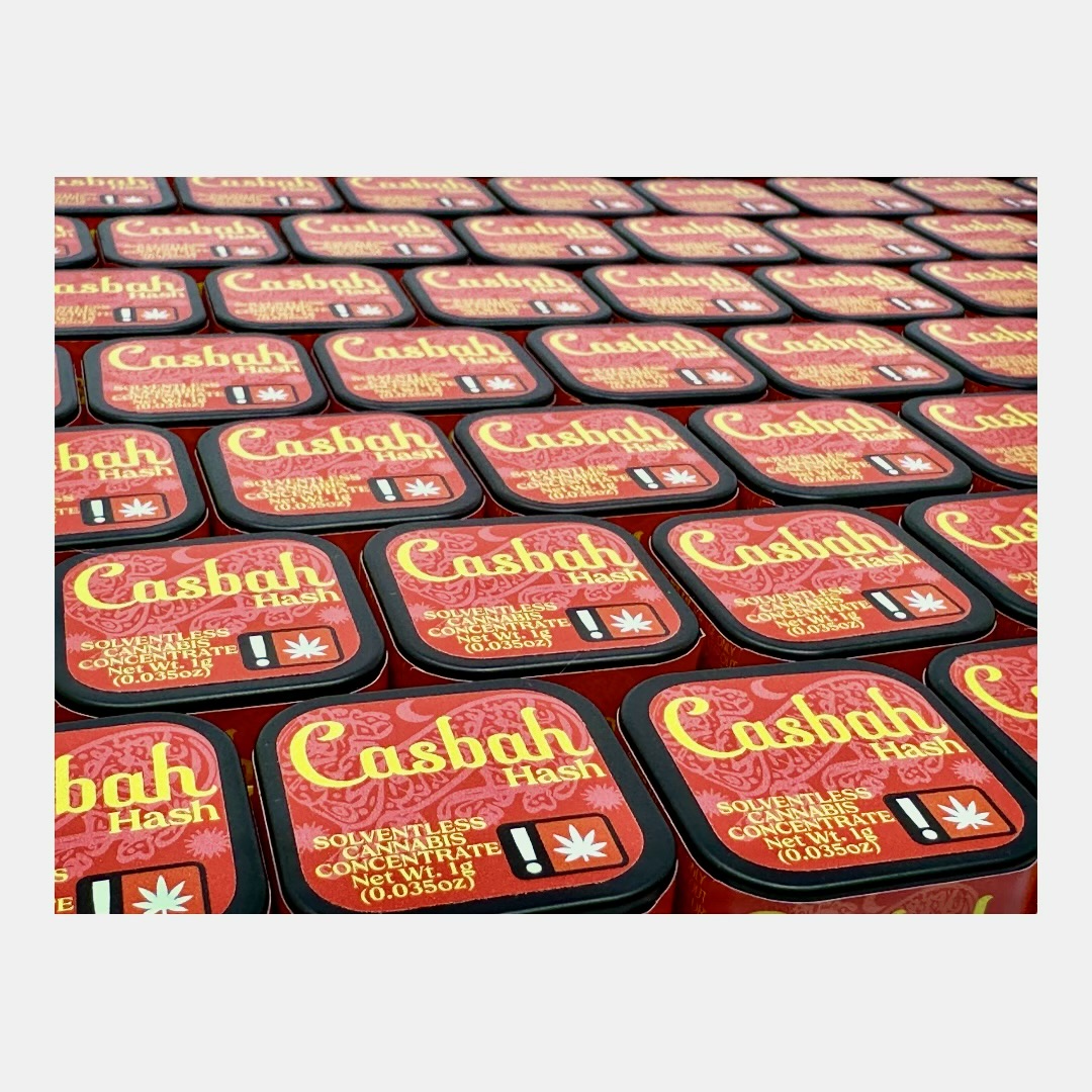 Rows of Casbah Hash tins, packed by hand